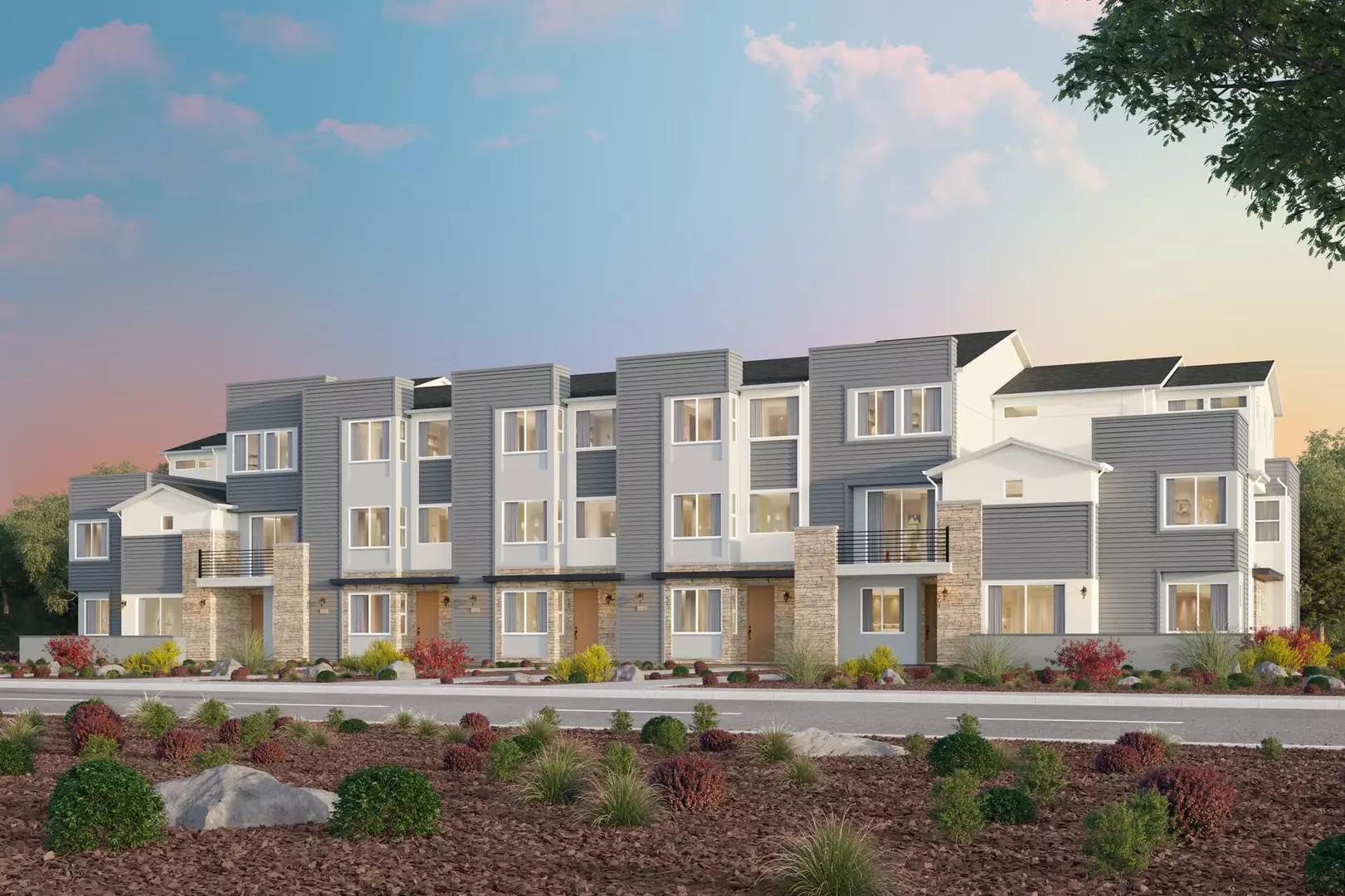 Modern row of townhouses with landscaped front yard